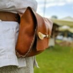 woman in brown leather shoulder bag